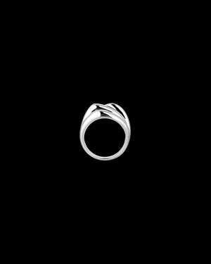 A polished silver ring with a unique, flowing wave-like band design, centered on a solid black background.